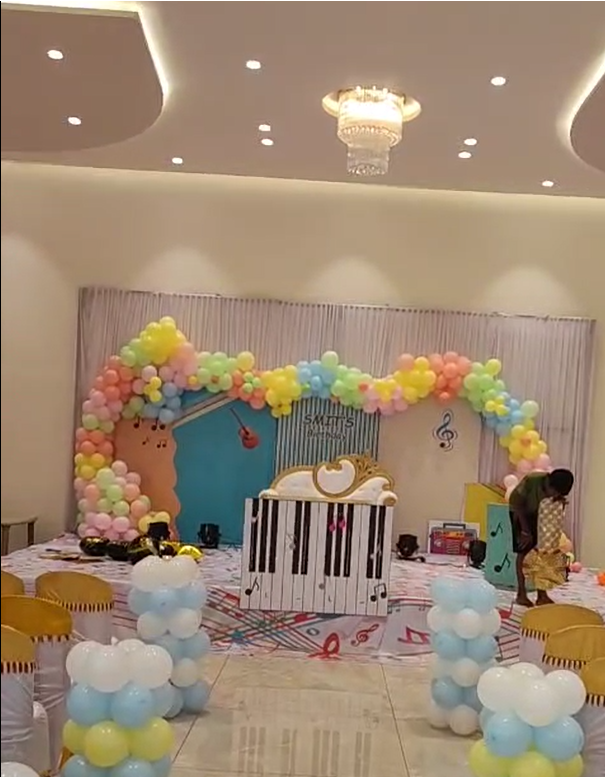 Balloon arch birthday stage setup at Raj Rajeshwari AC Banquet Hall, Jule Solapur